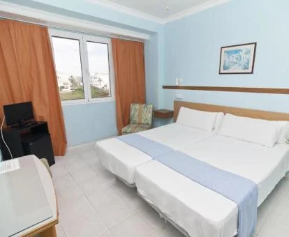 Una de las acogedoras habitaciones sencillas de este hotel boutique.