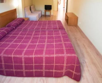 Una de las acogedoras habitaciones de este hotel tradicional.