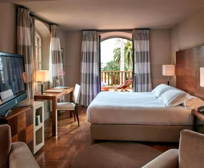 Una de las amplias habitaciones con un acogedor estilo elegante de este hotel boutique.
