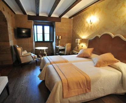 Una de las acogedoras habitaciones de estilo tradicional del hotel.