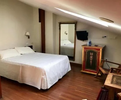 Una de las acogedoras habitaciones dobles de estilo tradicional de este hotel con encanto.